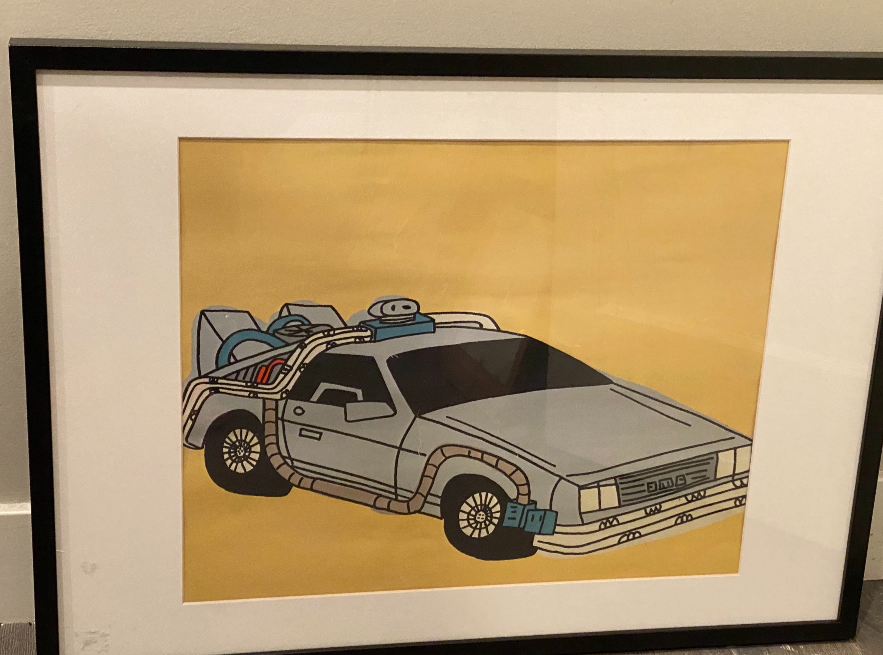 Rare Marz Jr. signed pop art of DMC DeLorean, framed and colorful, showcasing nostalgic design.